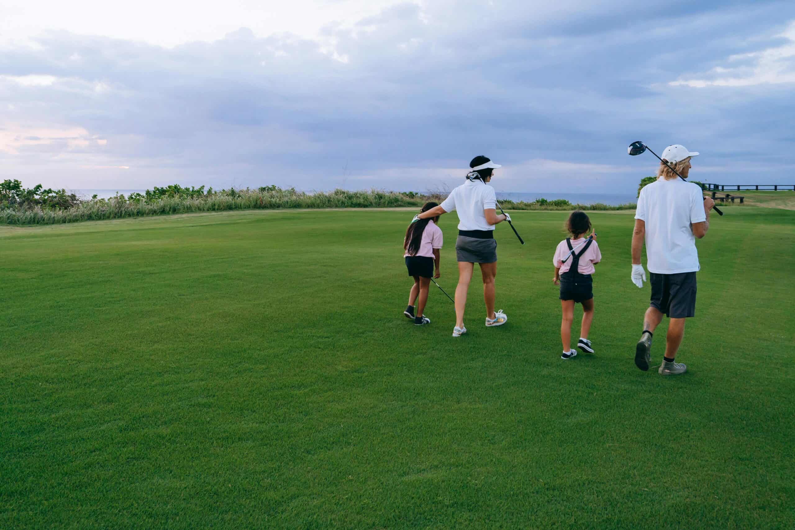Juniors paying golf on the course